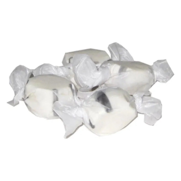 Wrapped pieces of Black Licorice salt water taffy, white with a dark stripe