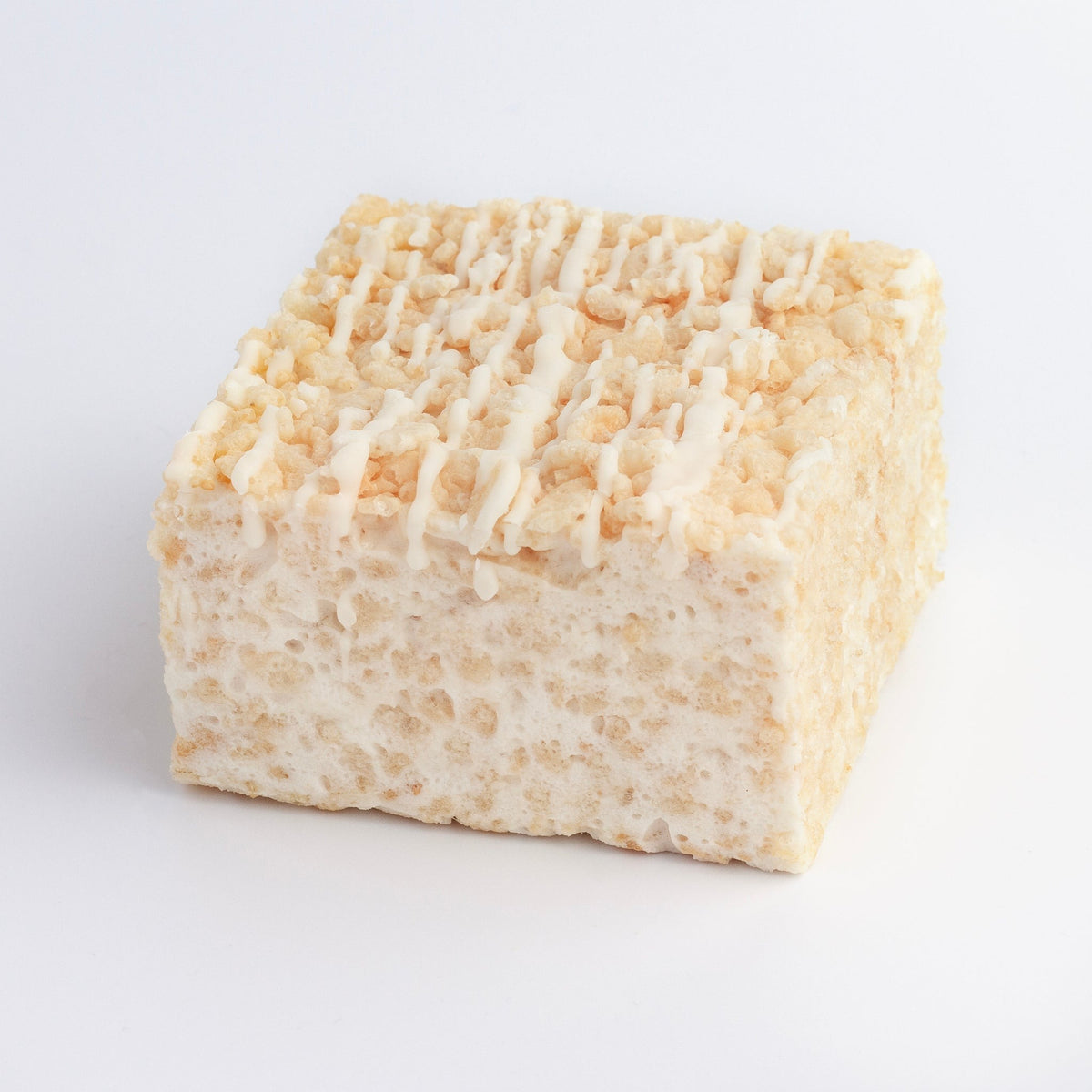The Crispery Drizzled White Chocolate Crispycake: marshmallow crispy rice square topped with mini crisped rice and thin lines of white chocolate
