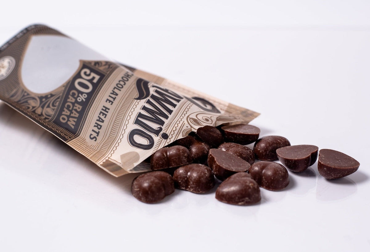 Windy City Organics Rawmio Oat Milk Chocolate Hearts styled on a table