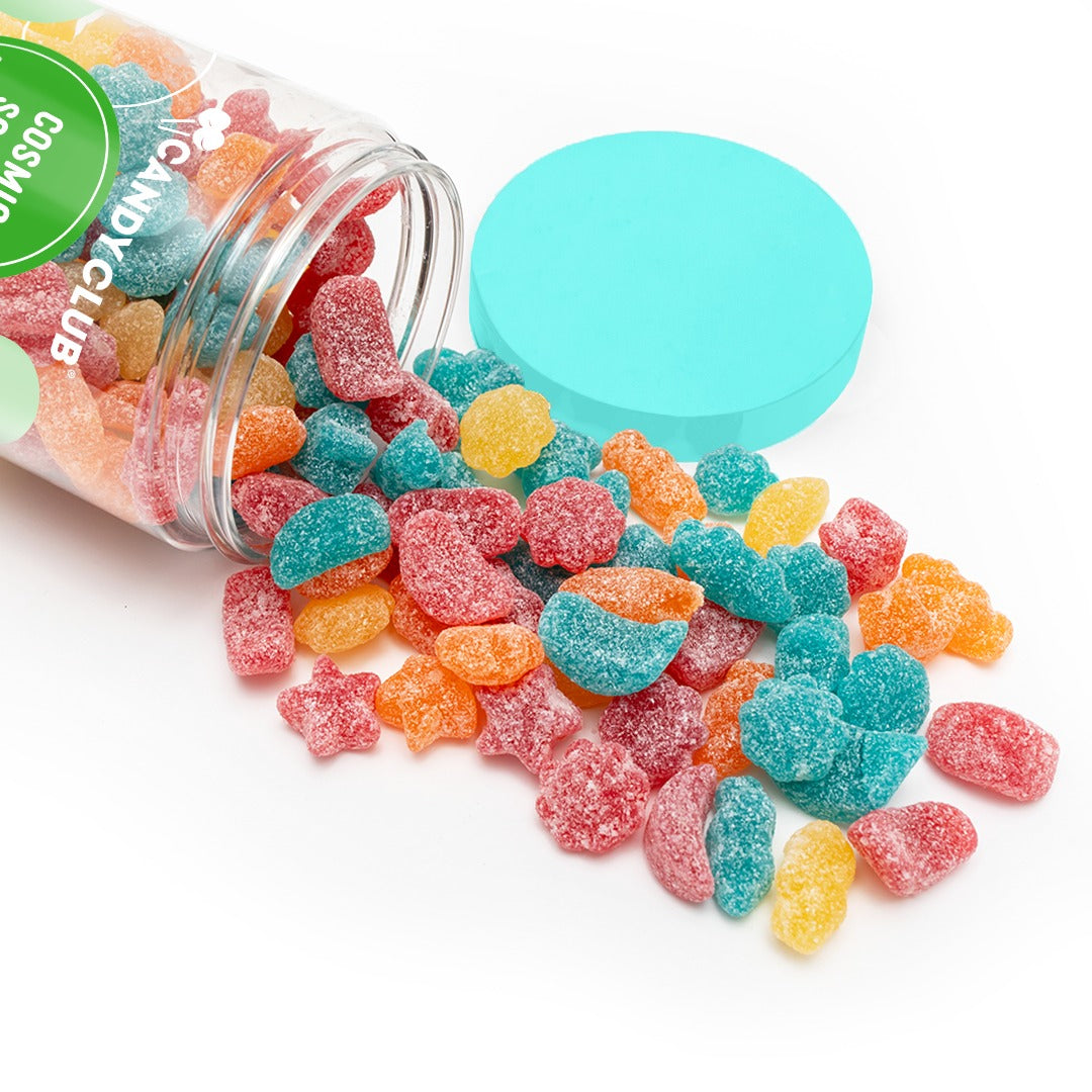 Cosmic Sours star and moon gummies in red, orange, yellow and blue spilling from a tipped Candy Club cup
