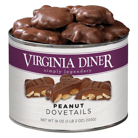 Virginia Diner Peanut Dovetails 18 oz tin, purple label band with a cut cluster showing peanuts and caramel, heaped with chocolate-covered clusters; label reads Net Wt 18 oz (1 lb 2 oz) (510 g)