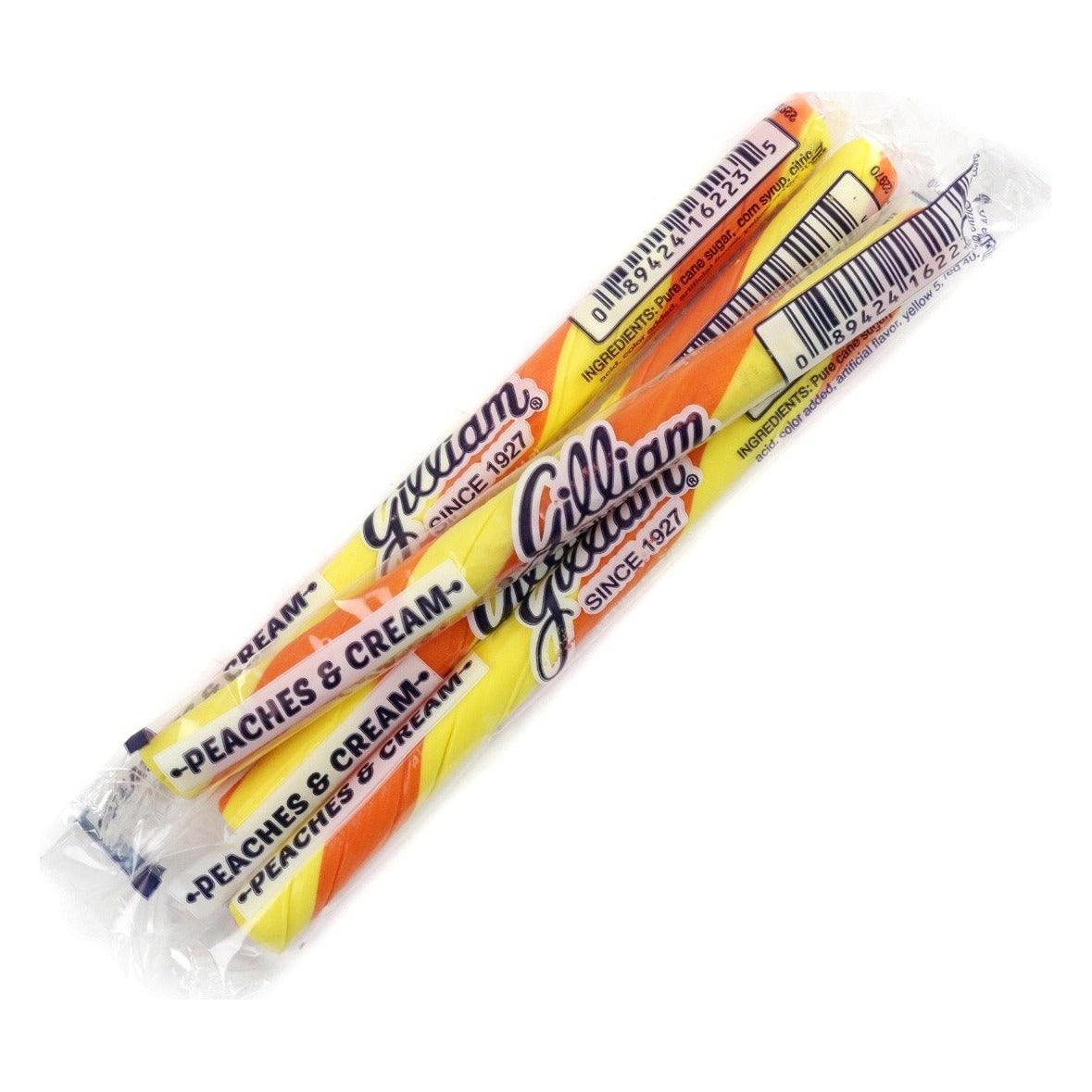 Three Gilliam Peaches & Cream stick candies in clear wrappers, orange and yellow striped sticks, wrappers printed Gilliam Since 1927 and Peaches & Cream