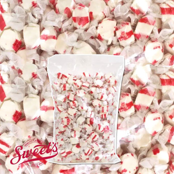 Clear bulk bag of wrapped red-and-white Sweet's Peppermint taffy shown over a close-up of the pieces with the Sweet's logo