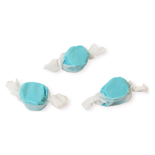 Three wrapped pieces of Sweet's Blue Raspberry taffy in light blue on a white background