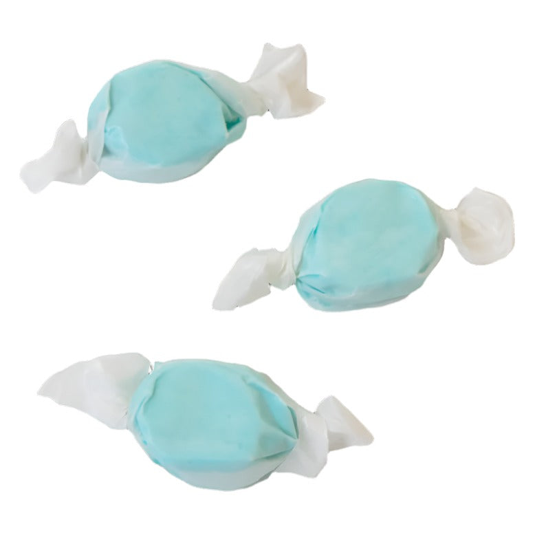 Three wrapped pieces of Sweet's Cotton Candy taffy in light blue on a white background
