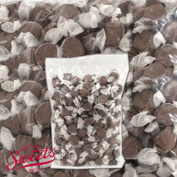 Clear bulk bag of wrapped brown Sweet's Chocolate taffy over a close-up of the pieces with the Sweet's logo