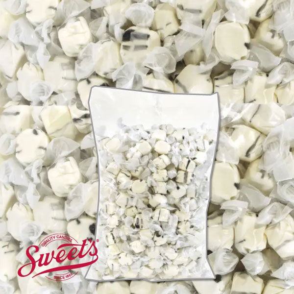 Clear bulk bag of wrapped Sweet's Black Licorice taffy over a close-up of the white and black pieces with the Sweet's logo