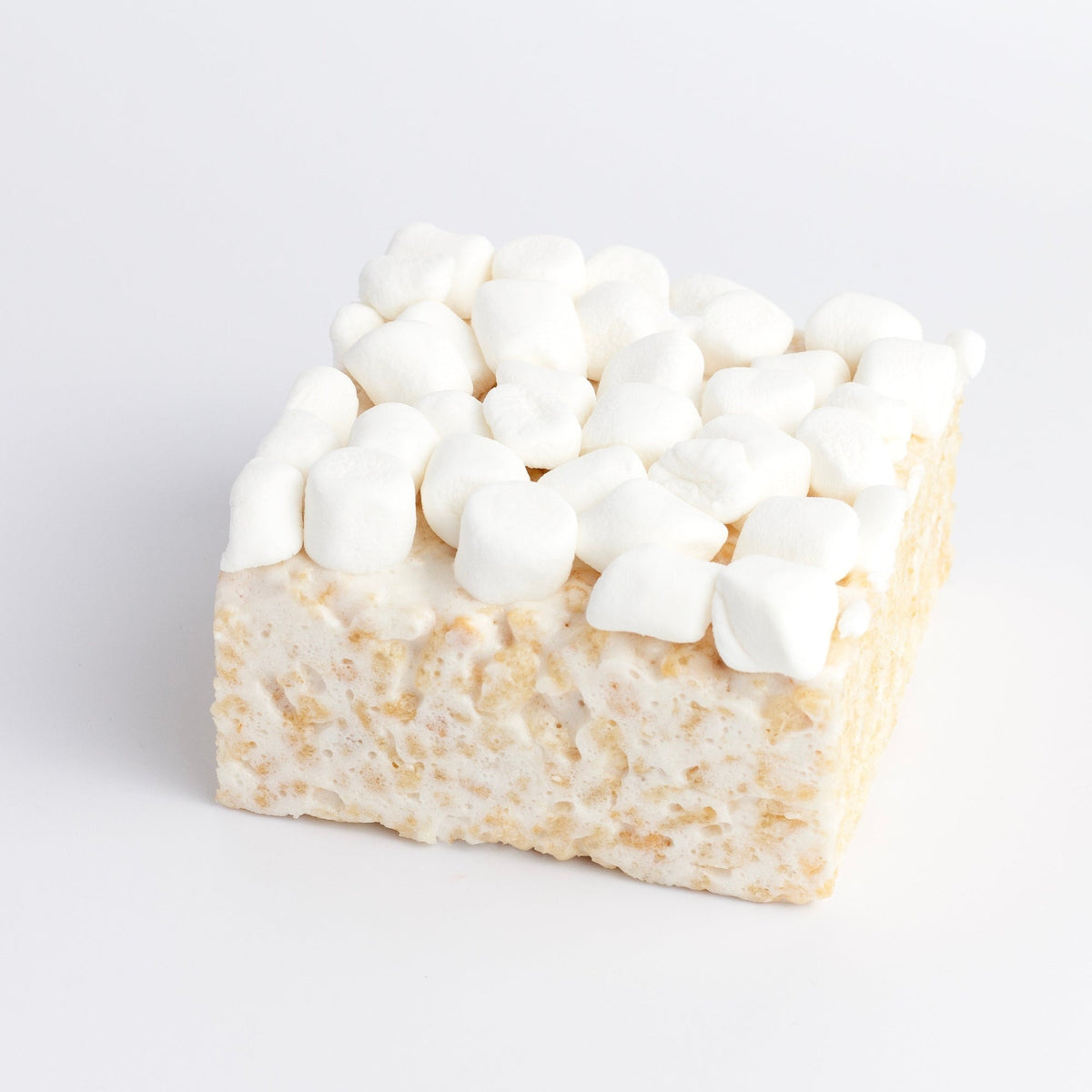 Mini Marshmallow Crispycake on a white background, top covered in mini marshmallows over a crispy rice and marshmallow base