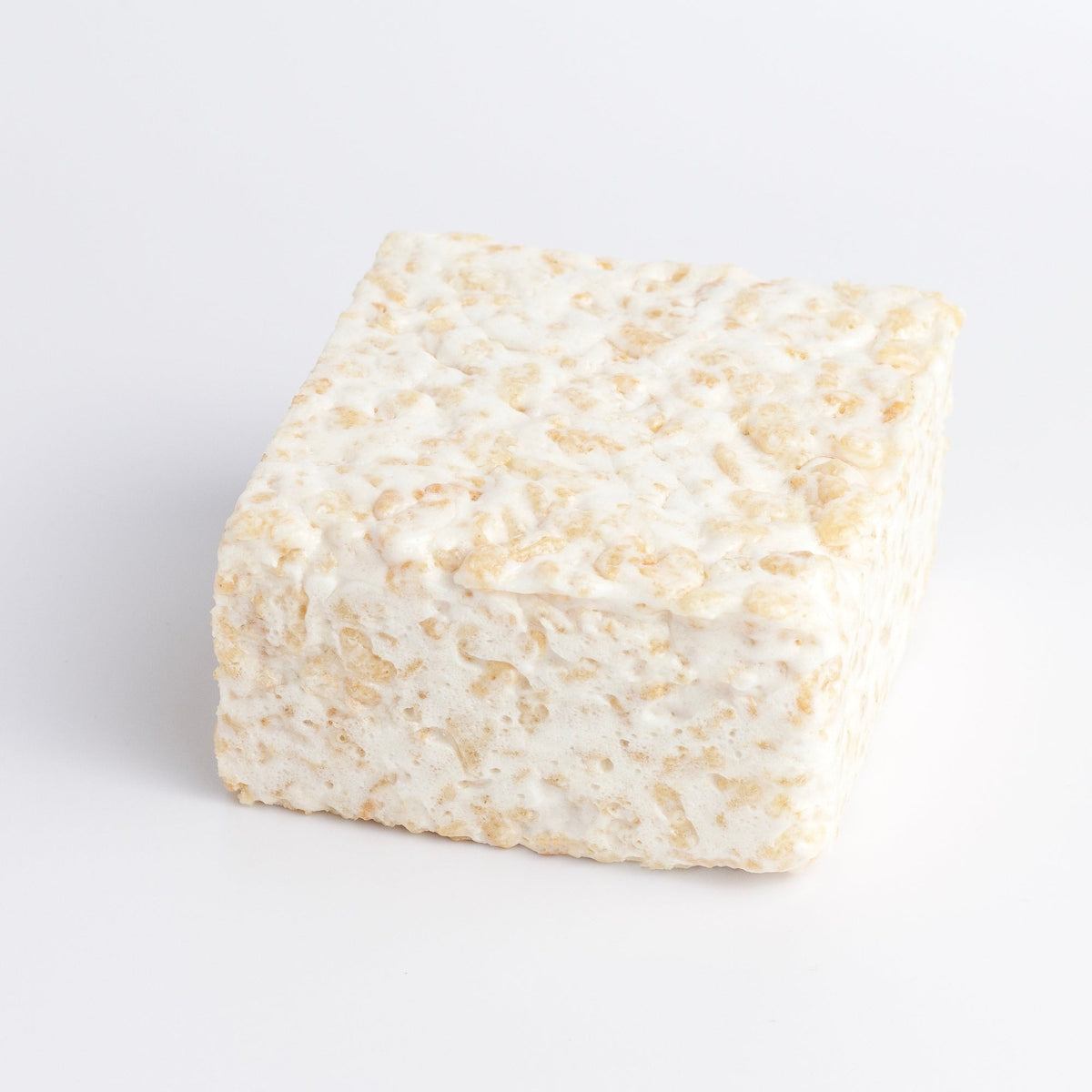 Plain & Sweet Crispycake on a white background, a thick square of puffed rice and marshmallow