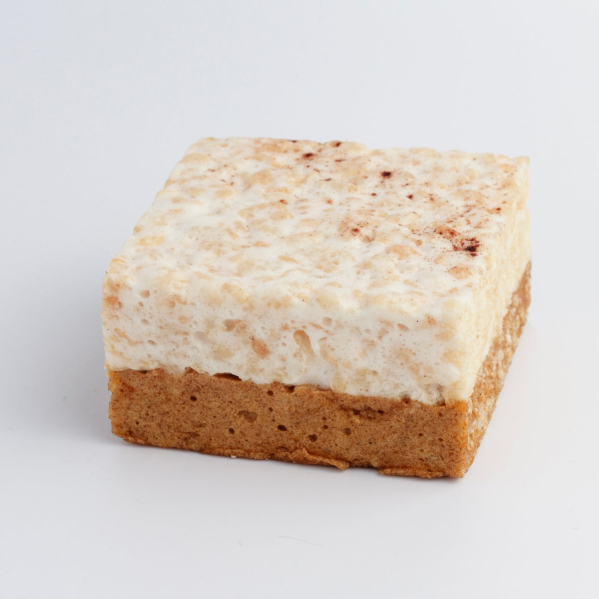Pumpkin Spice Crispycake on a white background showing the spiced marshmallow top and graham cracker crust