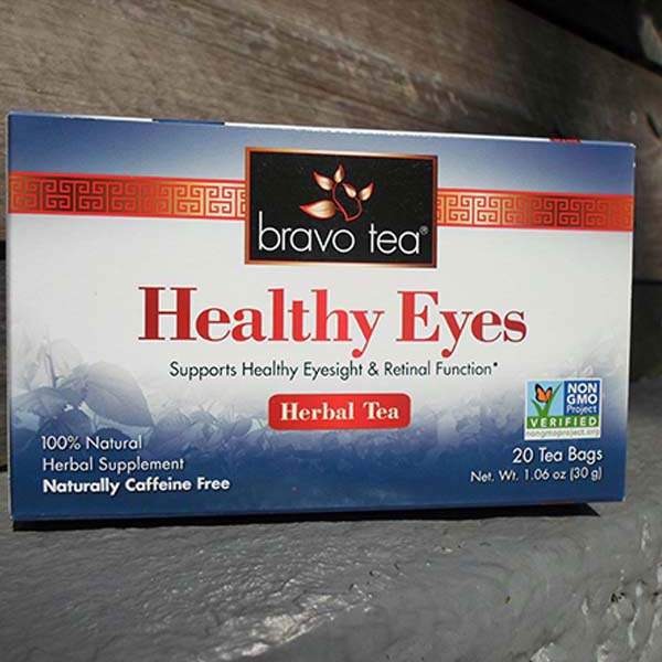 Bravo Healthy Eyes Herbal Tea box lying on a weathered wooden surface