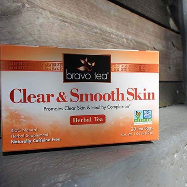 Bravo Tea Clear & Smooth Skin box lying on its side on a weathered wooden ledge
