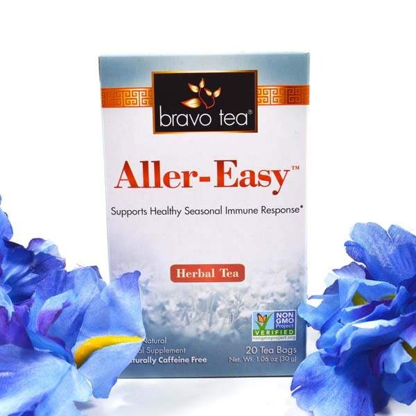 Bravo Tea Aller-Easy box standing between blue iris flowers