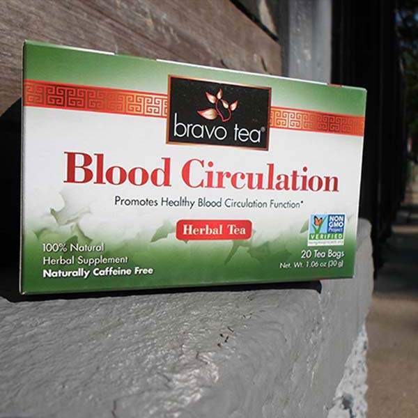Bravo Tea Blood Circulation box lying on its side on a stone ledge outdoors