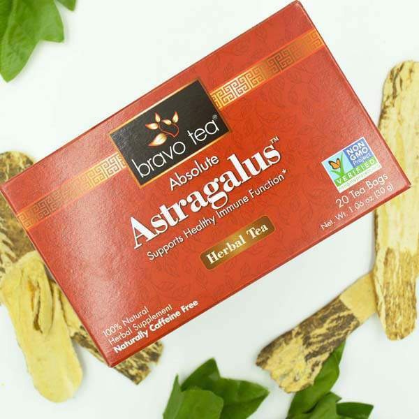 Bravo Tea Absolute Astragalus box beside sliced dried astragalus root and green leaves