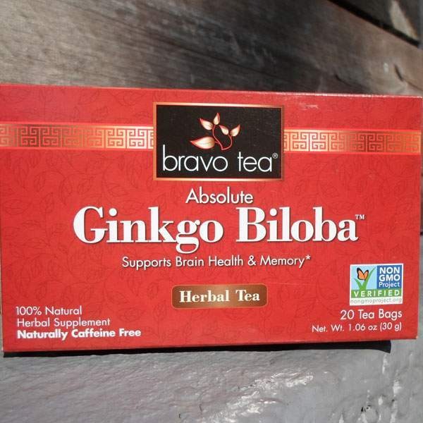 Bravo Tea Absolute Ginkgo Biloba box lying on its side on weathered wood