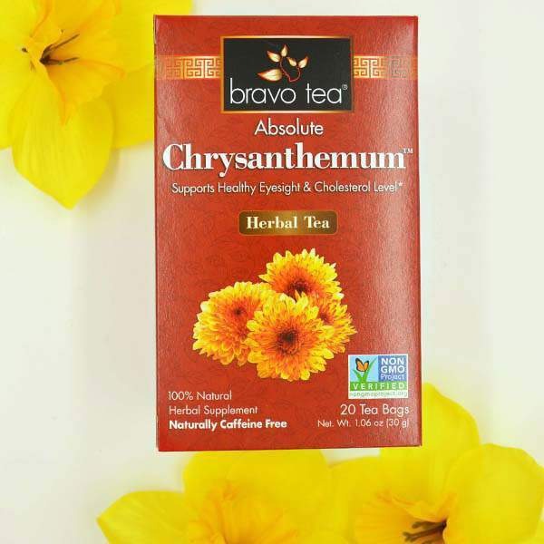 Bravo Tea Absolute Chrysanthemum box upright against a white background with yellow daffodils, front panel with orange flower artwork