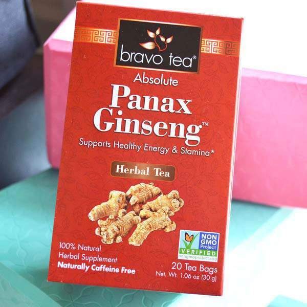 Bravo Tea Absolute Panax Ginseng box standing in front of a pink and teal gift box