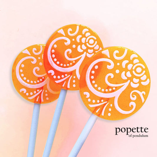 Popette of Pendulum Mango Fruit Cream Lollipops with Candied Vanilla Frosting