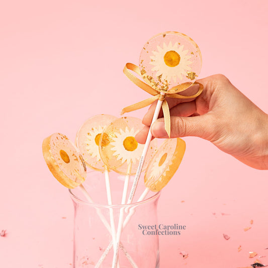 Sweet Caroline Confections Daisy and Gold Lollipops, Mandarin Orange, 10/Case - VEGAN