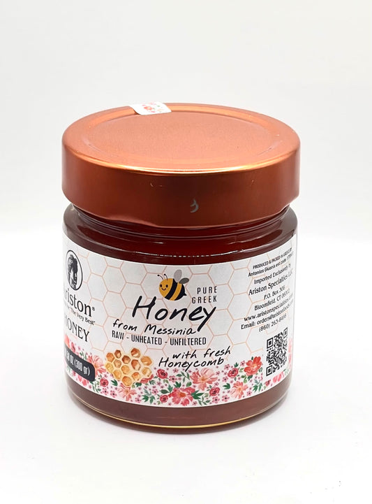 Ariston Specialties Greek wildflower honey with a piece of honeycomb in the jar