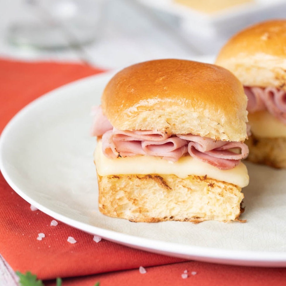 Bakerly Brioche Dinner Rolls styled on a table