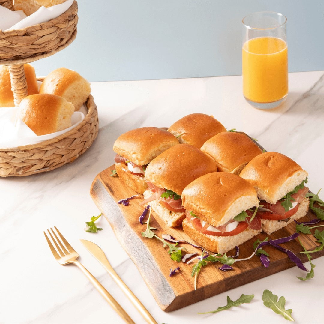 Bakerly Brioche Dinner Rolls styled on a table