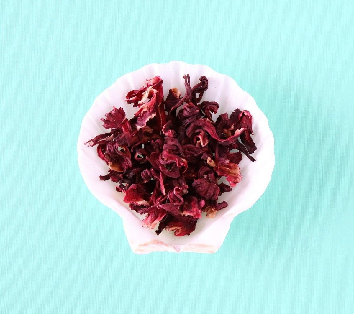 Bespoke Provisions Hibiscus Flower Tea, Loose Leaf styled on a table