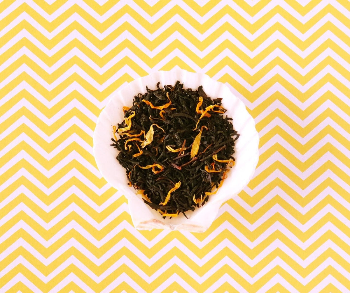 Bespoke Provisions Mango Tropical Black Tea, Loose Leaf styled on a table