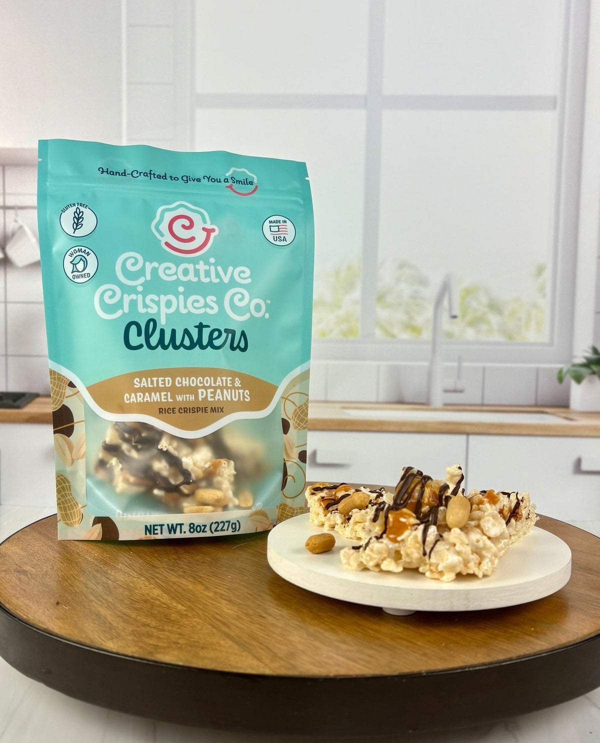 Creative Crispies Co. Dark Chocolate, Caramel, Peanuts & Sea Salt Crispie Clusters, front of the package