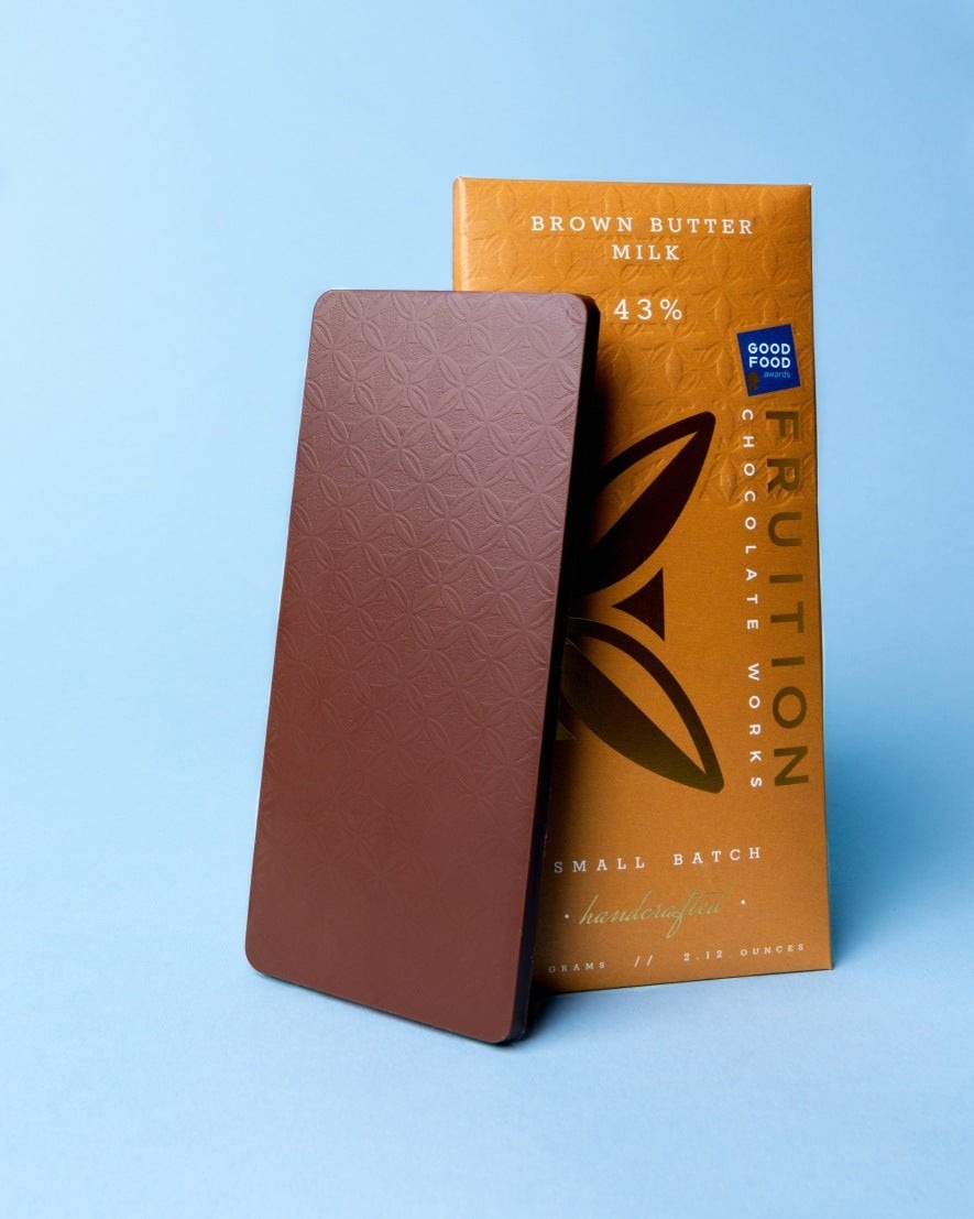 Fruition Chocolate Works Brown Butter Milk Chocolate 43% Bar styled on a table