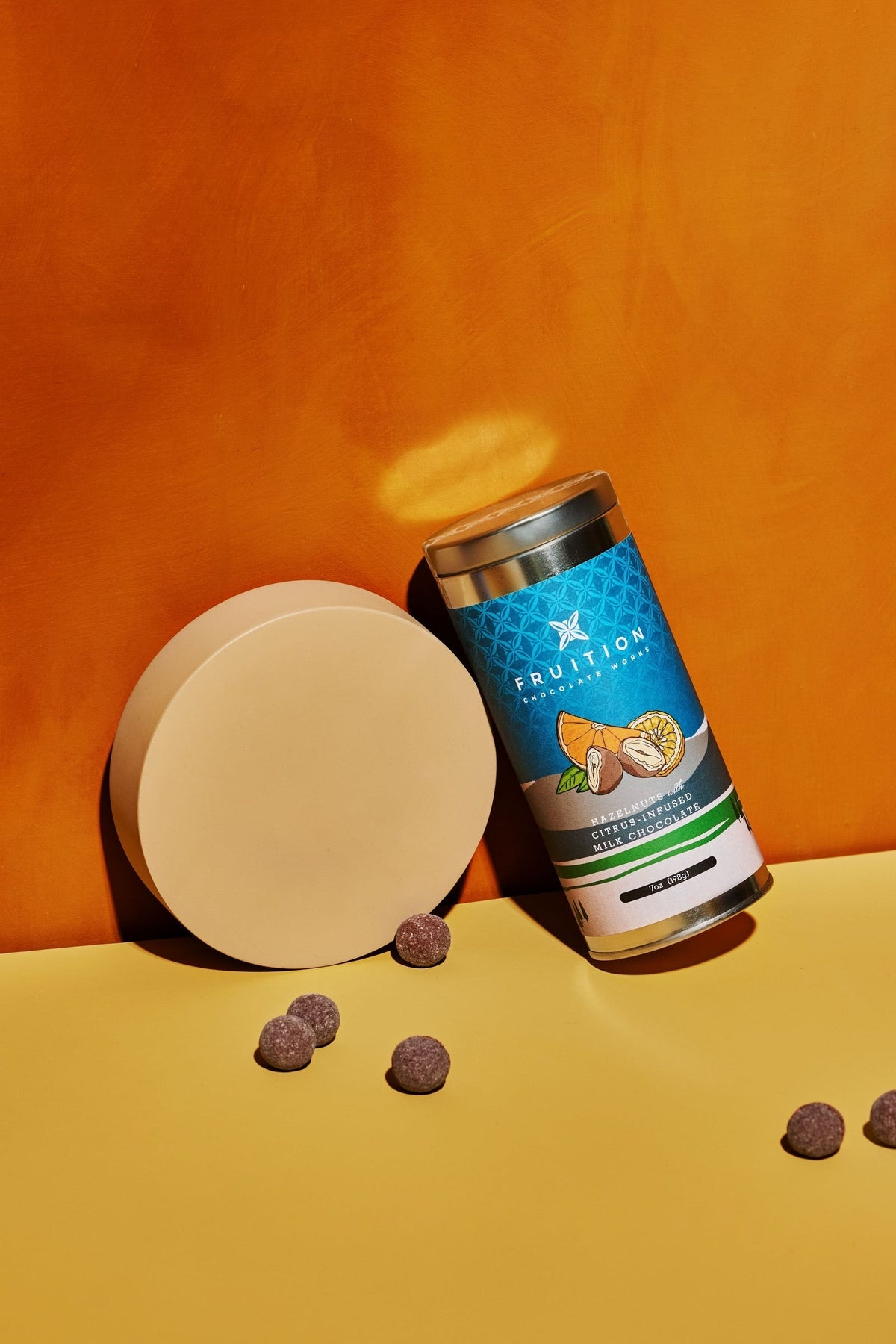 Fruition Chocolate Works Hazelnuts with Citrus-Infused Milk Chocolate styled on a table