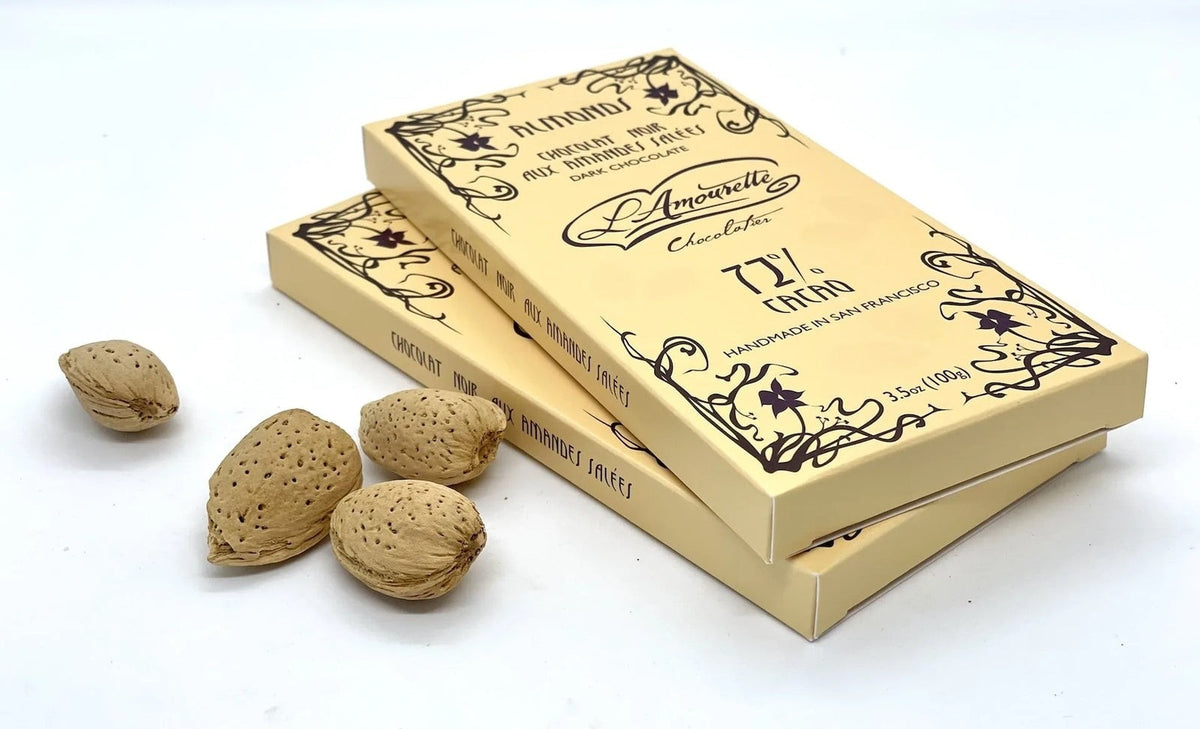 L'Amourette Chocolat 72% Dark Chocolate with Salted Almonds Bar styled on a table