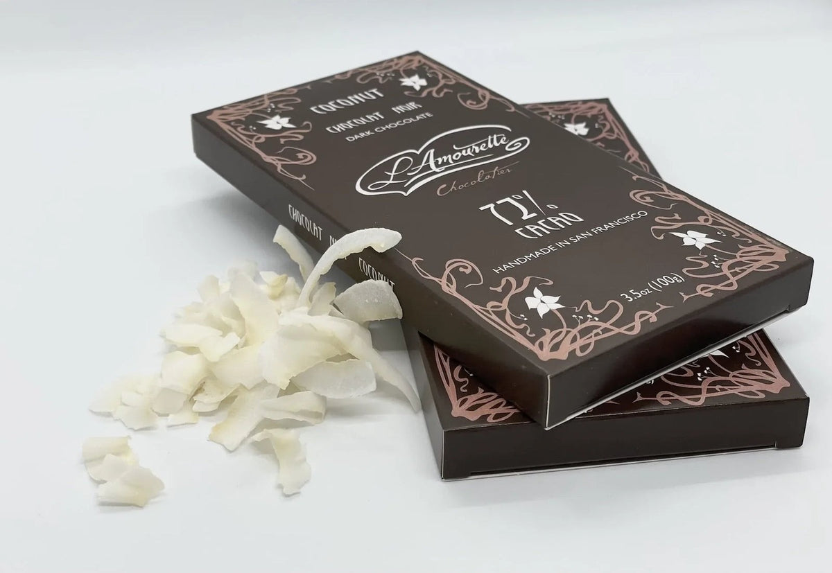 L'Amourette Chocolat 72% Dark Chocolate with Coconut Toasted in Honey Bar styled on a table