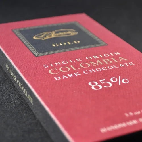 L'Amourette Chocolat Colombia 85% Dark Chocolate Bar styled on a table