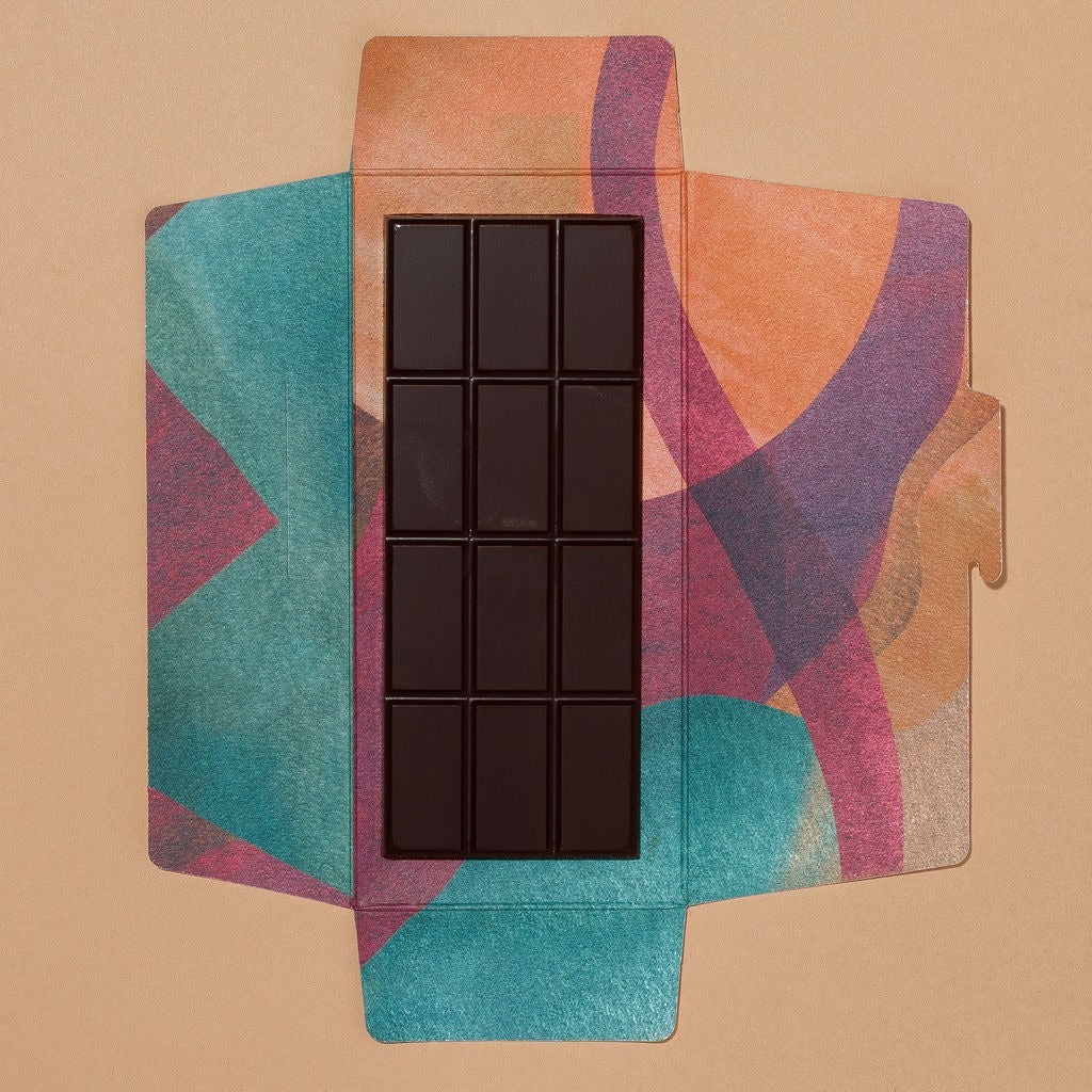 Close-up of Monsoon Chocolate Kokoa Kamili Tanzania 77% Dark Chocolate Bar as it comes out of the package