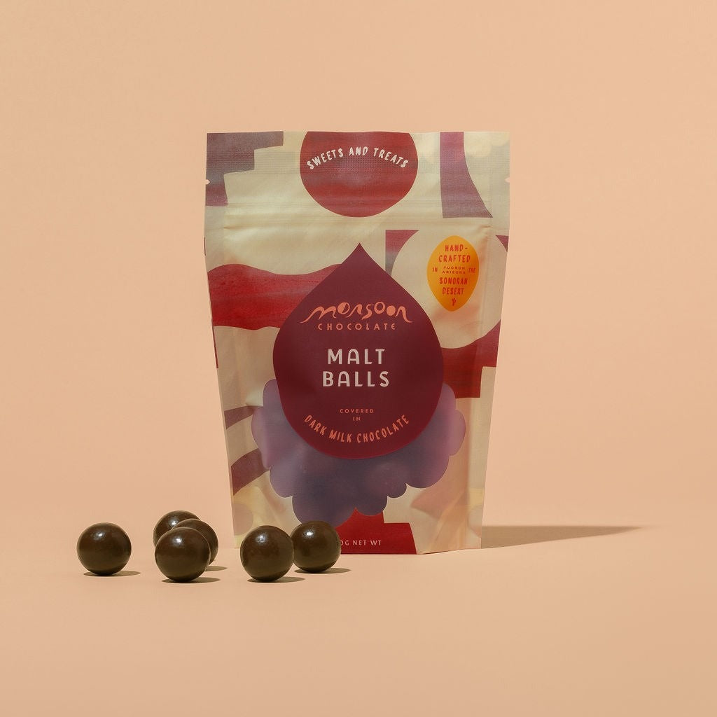 Close-up of Monsoon Chocolate Dark Milk Chocolate Covered Malt Balls as it comes out of the package