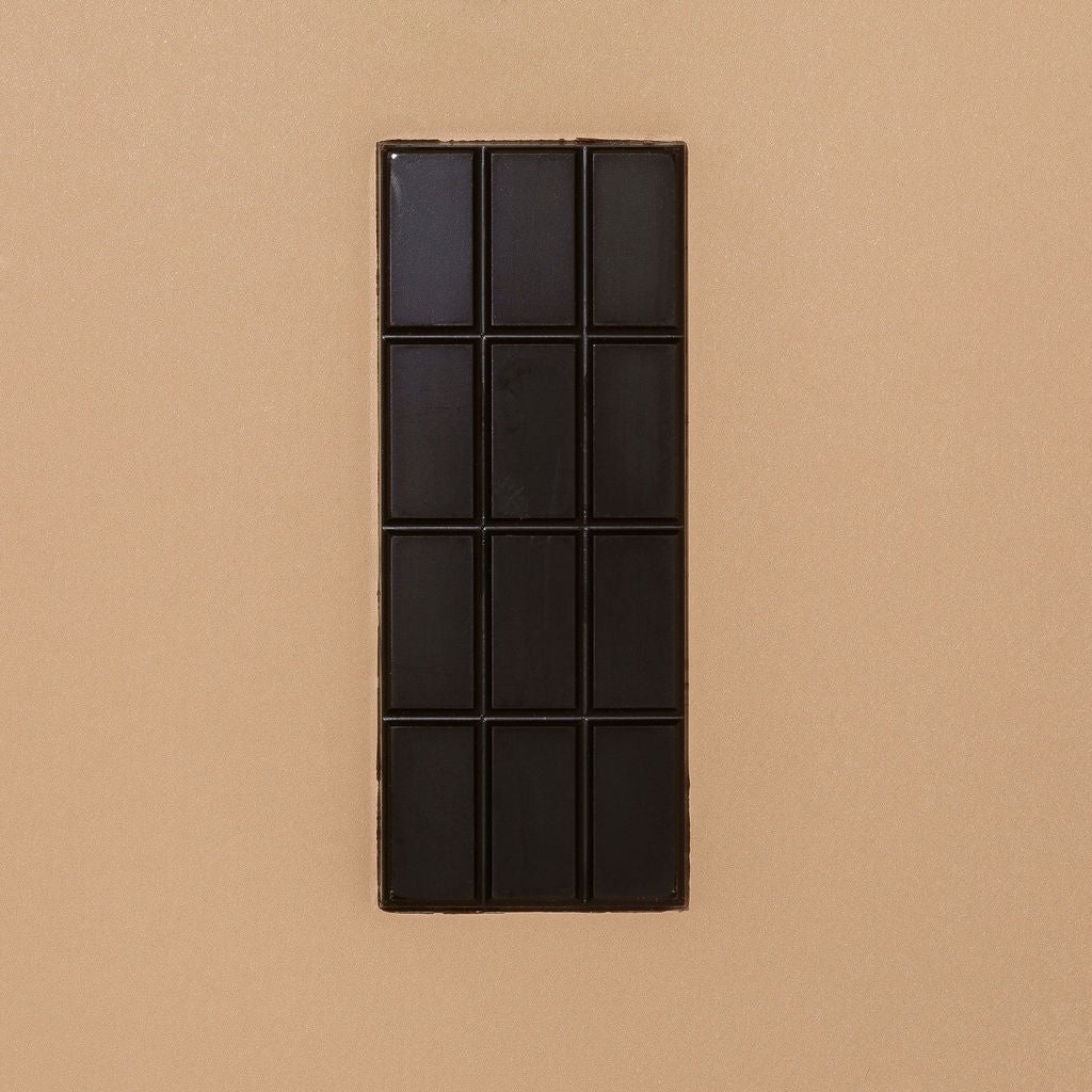 Close-up of Monsoon Chocolate Semuliki Forest Uganda 74% Dark Chocolate Bar as it comes out of the package