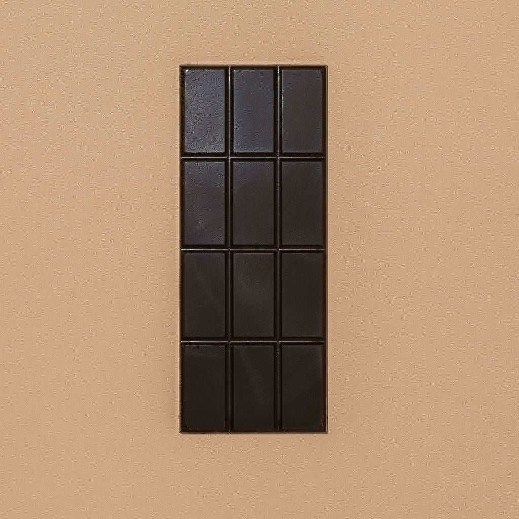 Close-up of Monsoon Chocolate Tranquilidad Bolivia 73% Dark Chocolate Bar as it comes out of the package