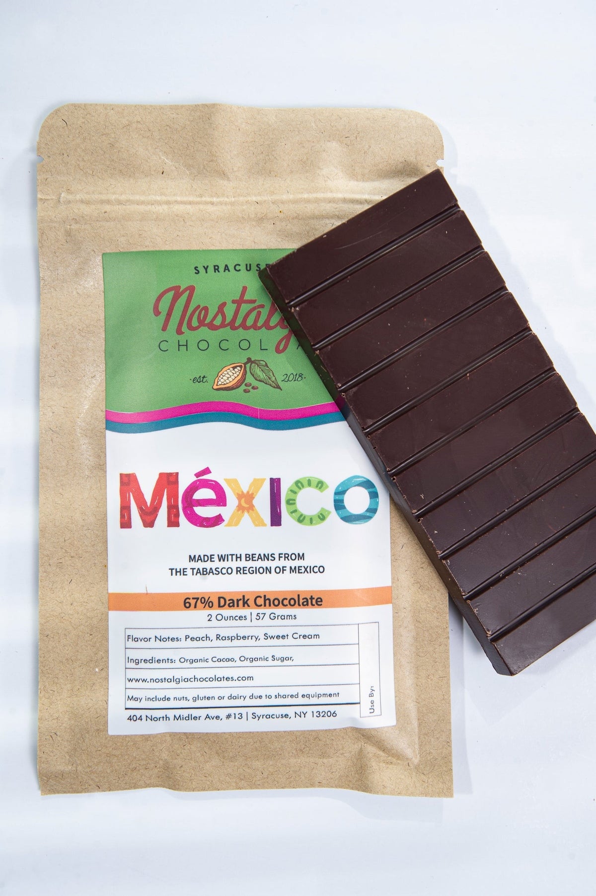 Close-up of Nostalgia Chocolates Mexico Tabasco Region 67% Dark Chocolate Bar as it comes out of the package