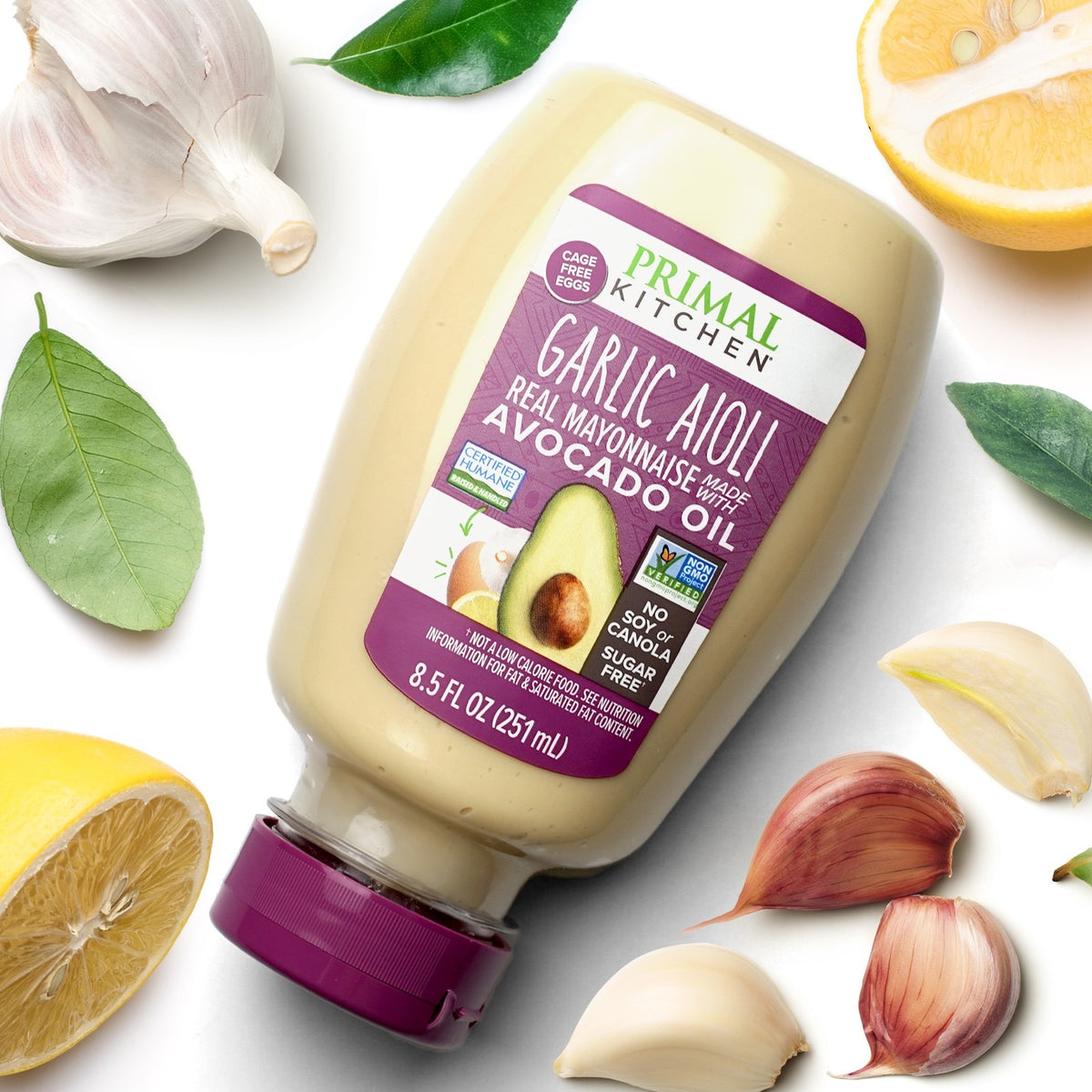 Primal Kitchen Squeeze Garlic Aioli Mayo styled on a table