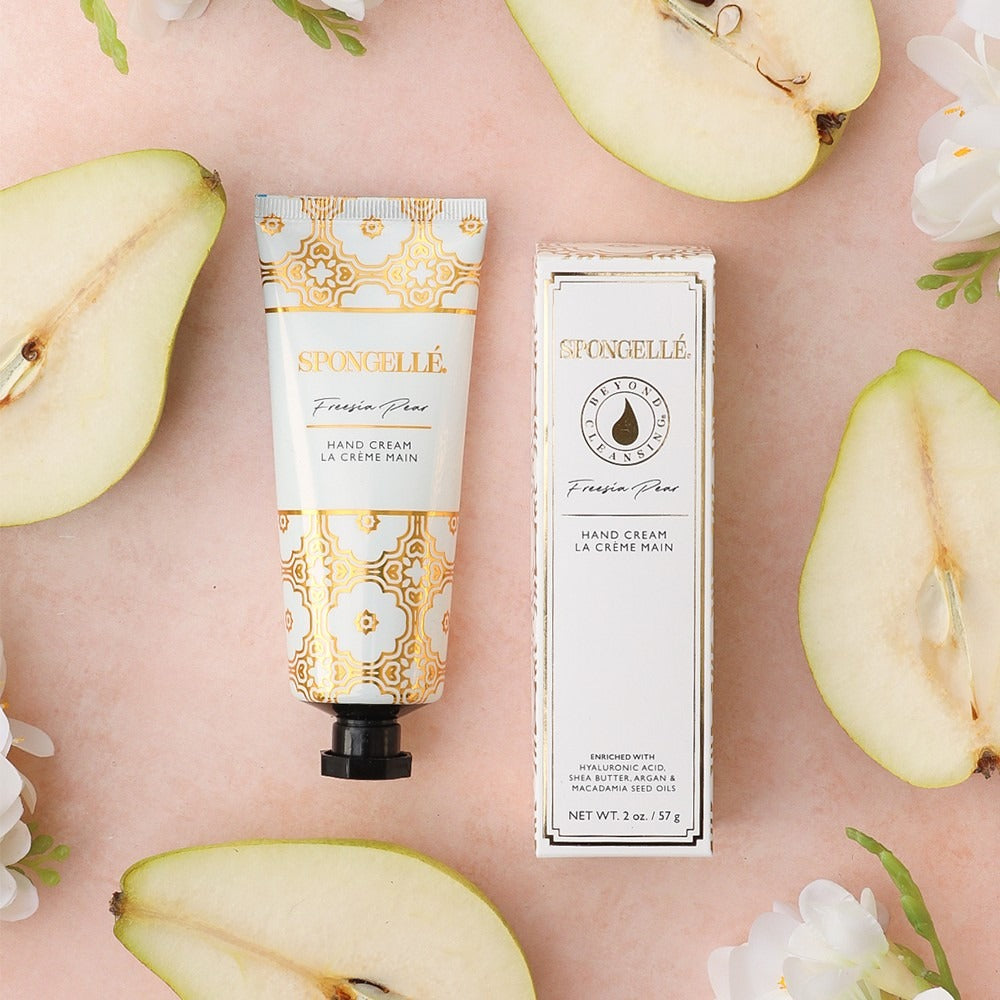Spongellé Freesia Pear Hand Cream styled on a table