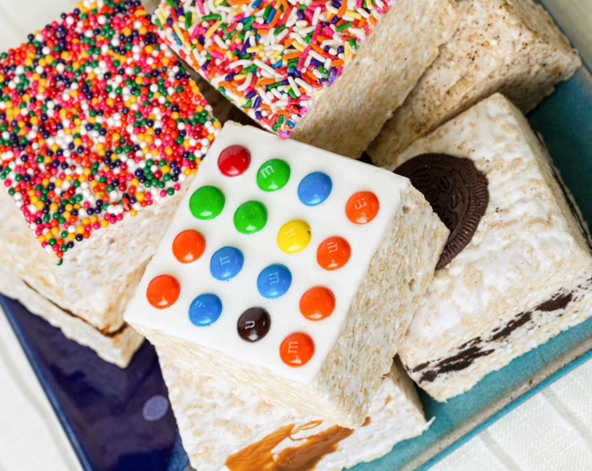 The Crispery Chocolate Candy Buttons Crispycake, Marshmallow Crispy Rice Treat styled on a table