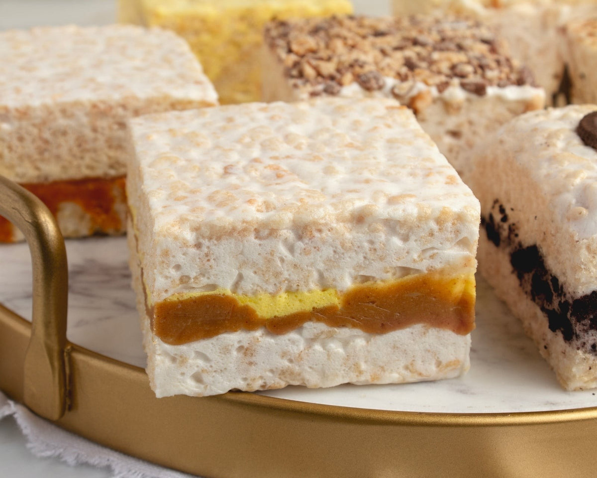 The Crispery Peanut Butter & Banana Crispycake, Marshmallow Crispy Rice Treat styled on a table