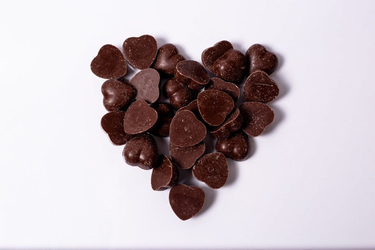 Close-up of Windy City Organics Rawmio Oat Milk Chocolate Hearts as it comes out of the package